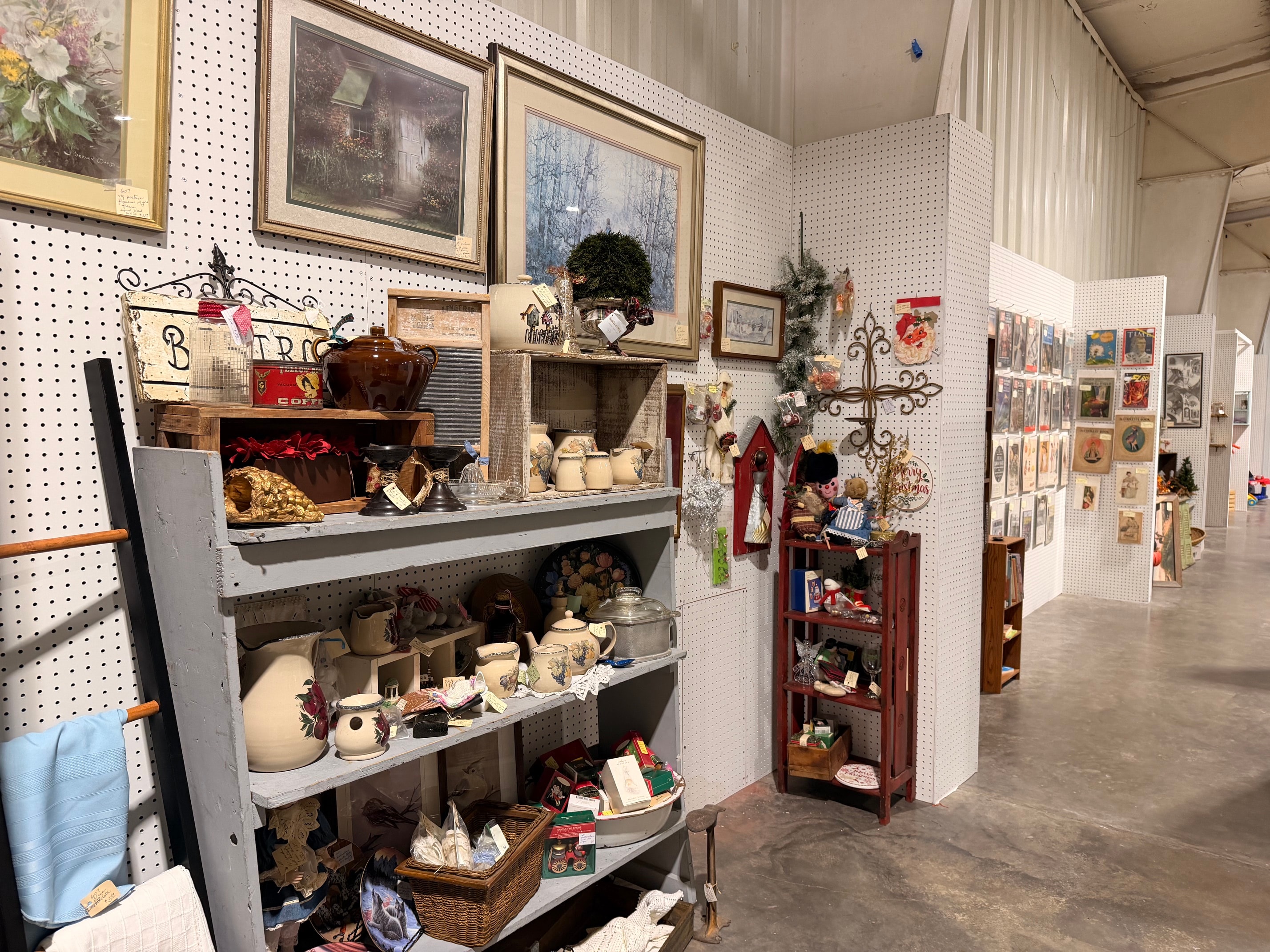 Booth with framed art and collectibles